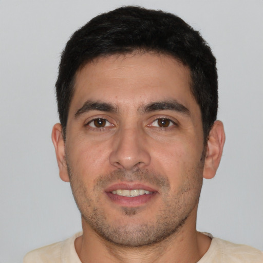 Joyful white young-adult male with short  brown hair and brown eyes