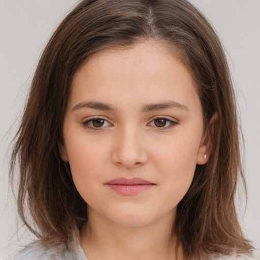 Joyful white child female with medium  brown hair and brown eyes