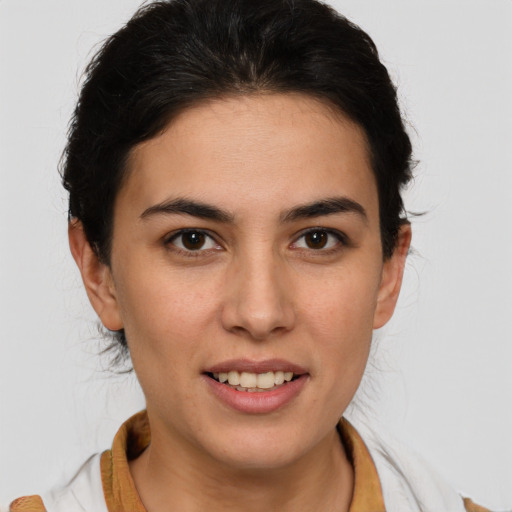 Joyful white young-adult female with medium  brown hair and brown eyes