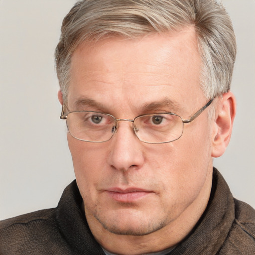 Neutral white middle-aged male with short  brown hair and blue eyes