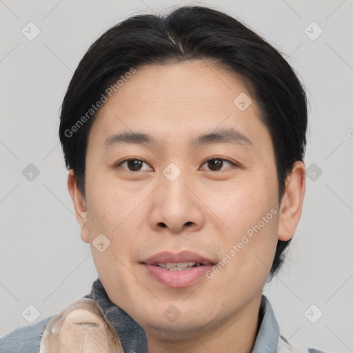 Joyful asian young-adult male with short  brown hair and brown eyes