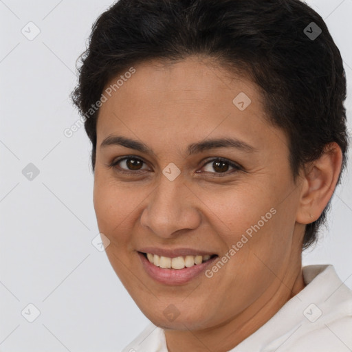 Joyful white young-adult female with short  brown hair and brown eyes