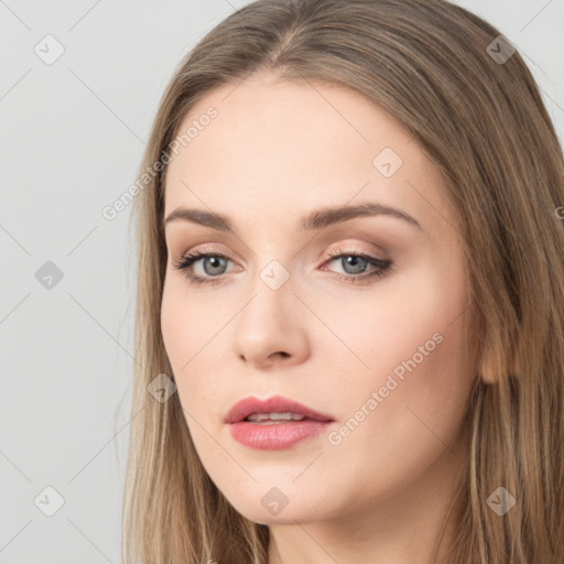 Neutral white young-adult female with long  brown hair and brown eyes