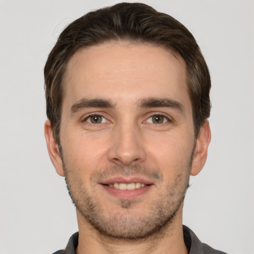 Joyful white young-adult male with short  brown hair and brown eyes