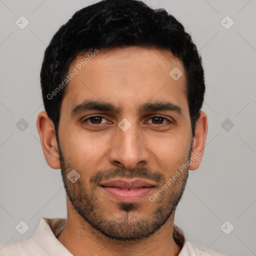 Joyful latino young-adult male with short  black hair and brown eyes