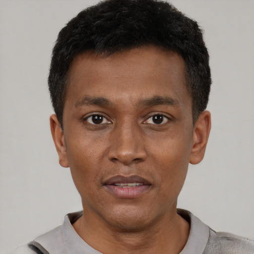 Neutral black young-adult male with short  black hair and brown eyes