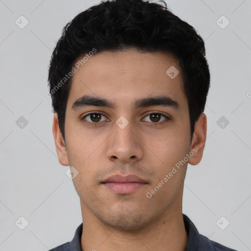 Neutral latino young-adult male with short  black hair and brown eyes