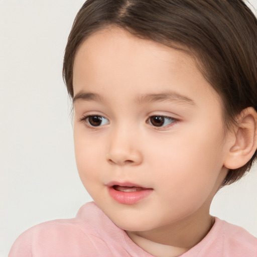 Joyful white child female with short  brown hair and brown eyes