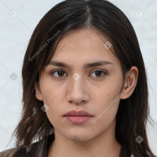 Neutral white young-adult female with long  brown hair and brown eyes