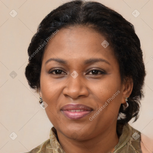 Joyful black adult female with medium  brown hair and brown eyes