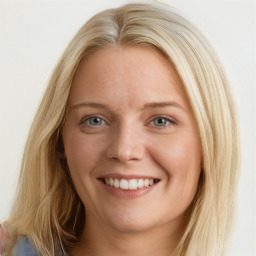 Joyful white young-adult female with long  brown hair and blue eyes