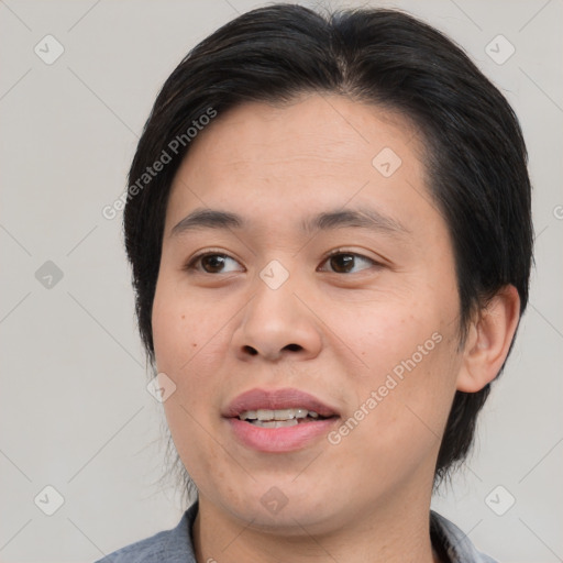 Joyful asian young-adult male with medium  brown hair and brown eyes