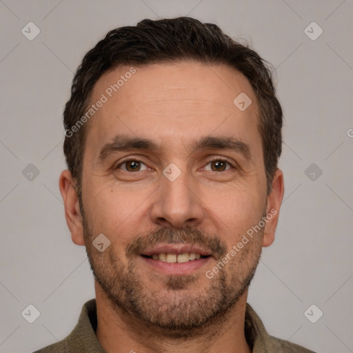 Joyful white adult male with short  brown hair and brown eyes