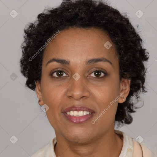 Joyful black adult female with short  brown hair and brown eyes