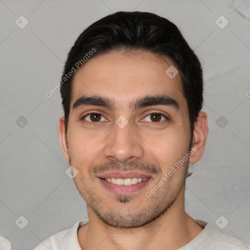 Joyful white young-adult male with short  black hair and brown eyes