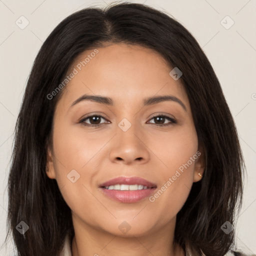 Joyful latino young-adult female with long  brown hair and brown eyes