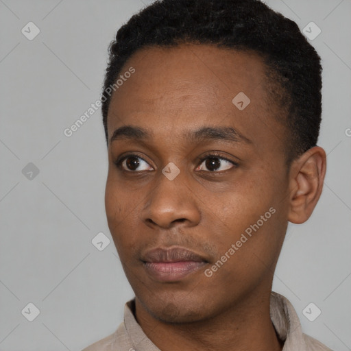 Neutral black young-adult male with short  black hair and brown eyes