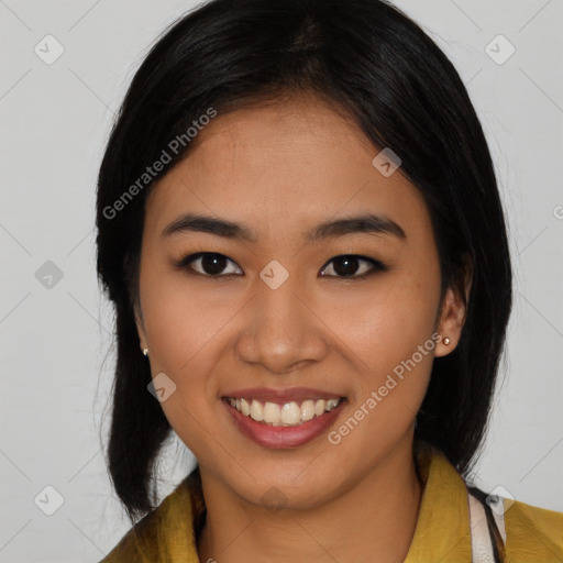 Joyful latino young-adult female with long  black hair and brown eyes