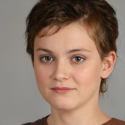 Joyful white child female with medium  brown hair and brown eyes