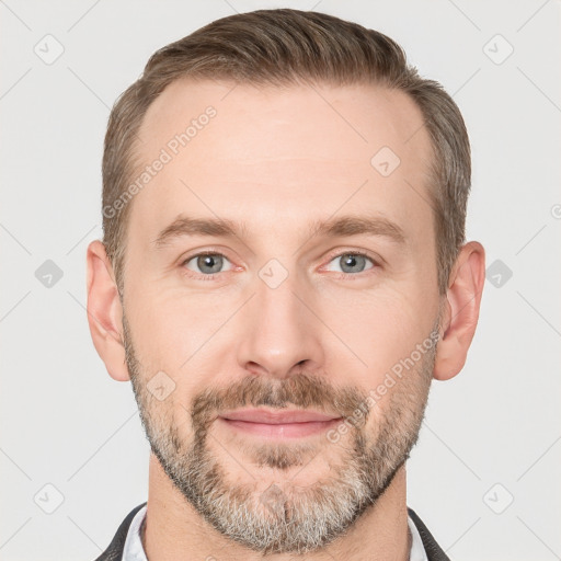 Joyful white adult male with short  brown hair and grey eyes