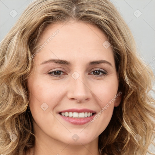 Joyful white young-adult female with long  brown hair and green eyes