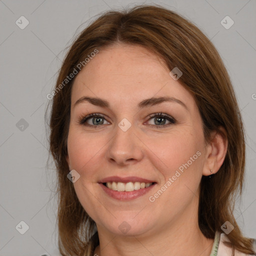 Joyful white young-adult female with medium  brown hair and green eyes