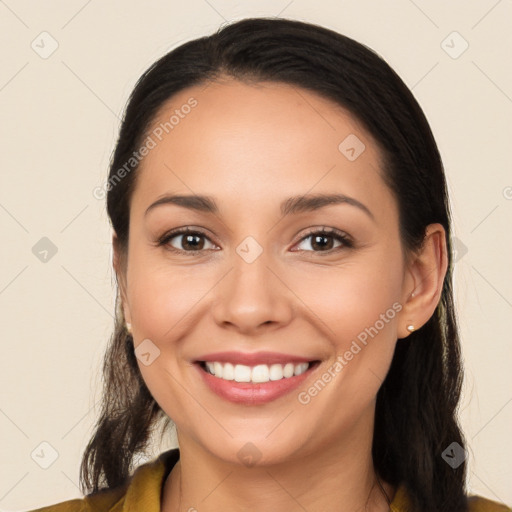 Joyful white young-adult female with long  brown hair and brown eyes