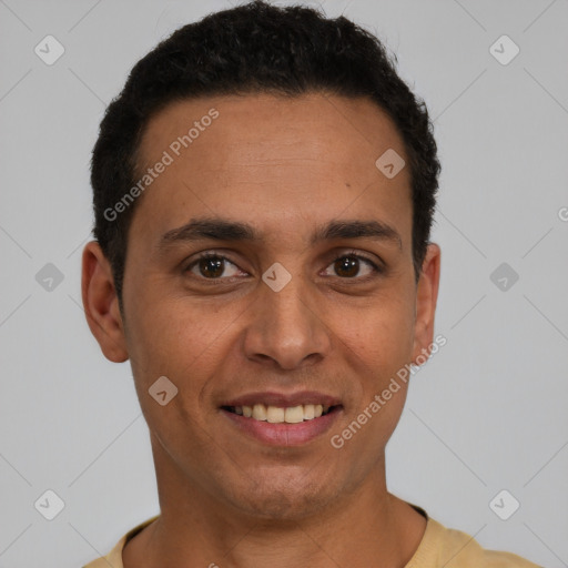 Joyful latino young-adult male with short  black hair and brown eyes