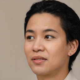 Joyful latino young-adult female with short  black hair and brown eyes