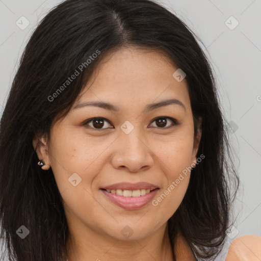 Joyful latino young-adult female with long  brown hair and brown eyes