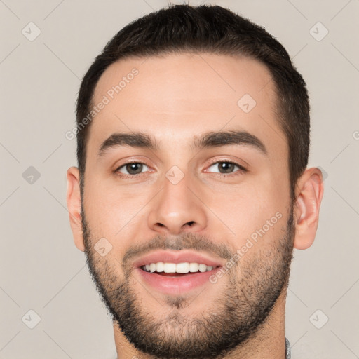 Joyful white young-adult male with short  black hair and brown eyes