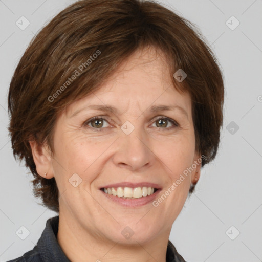 Joyful white adult female with medium  brown hair and grey eyes