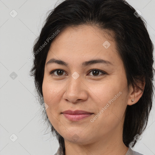 Joyful white adult female with medium  brown hair and brown eyes