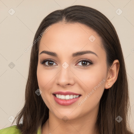 Joyful white young-adult female with long  brown hair and brown eyes