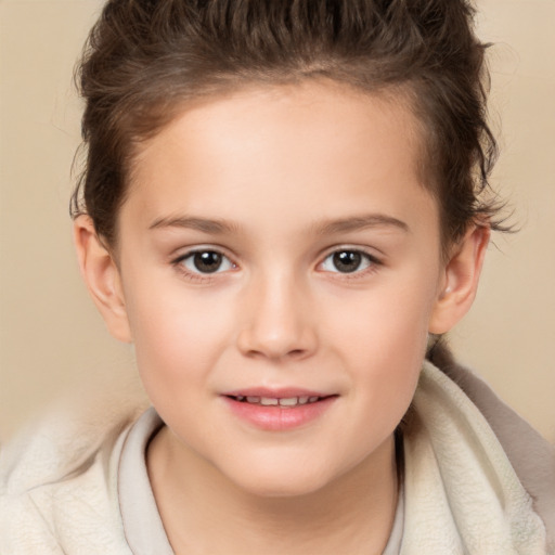 Joyful white child female with short  brown hair and brown eyes