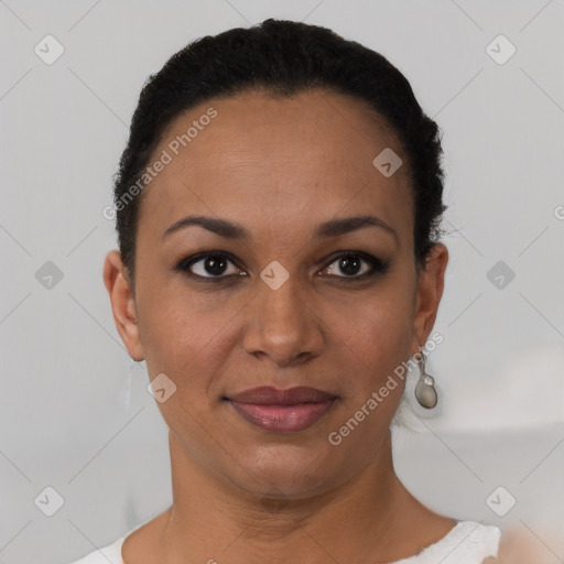 Joyful black young-adult female with short  black hair and brown eyes