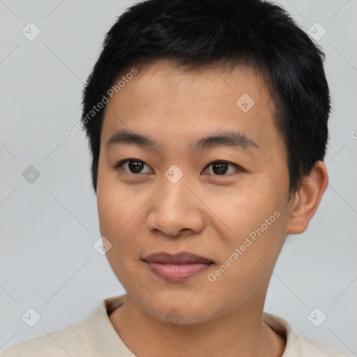 Joyful asian young-adult male with short  black hair and brown eyes