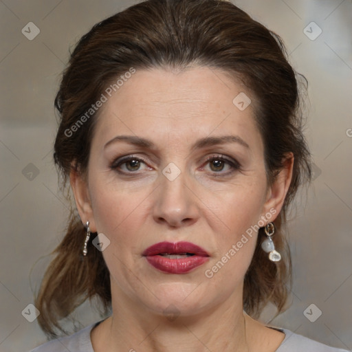 Joyful white adult female with medium  brown hair and brown eyes