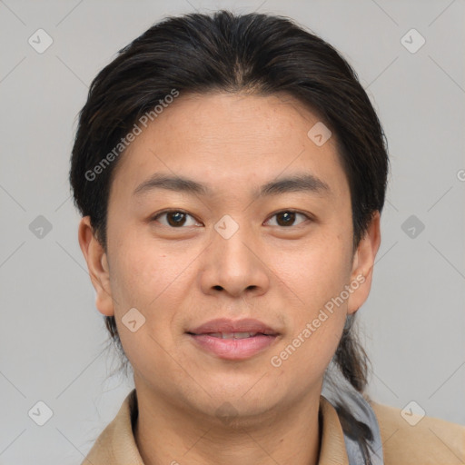 Joyful asian young-adult male with short  brown hair and brown eyes