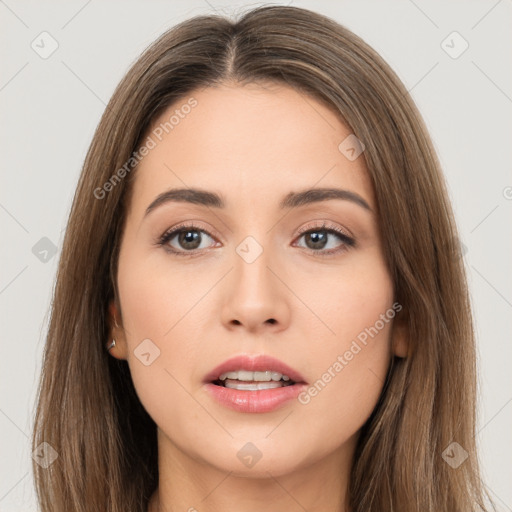 Neutral white young-adult female with long  brown hair and brown eyes