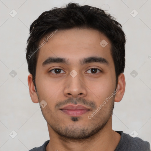 Neutral latino young-adult male with short  black hair and brown eyes