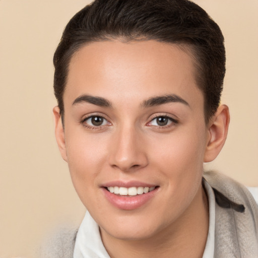 Joyful white young-adult female with short  brown hair and brown eyes