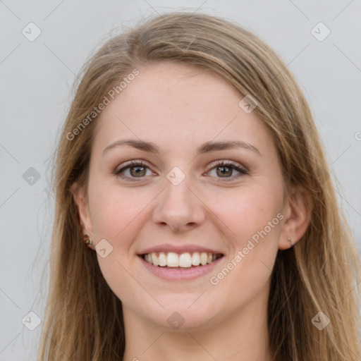 Joyful white young-adult female with long  brown hair and grey eyes