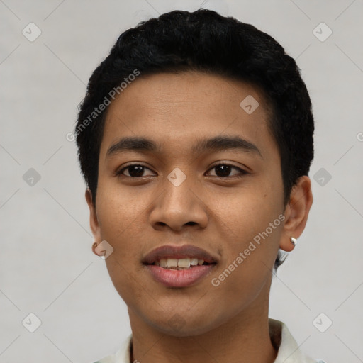 Joyful latino young-adult male with short  black hair and brown eyes