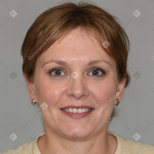 Joyful white adult female with medium  brown hair and blue eyes