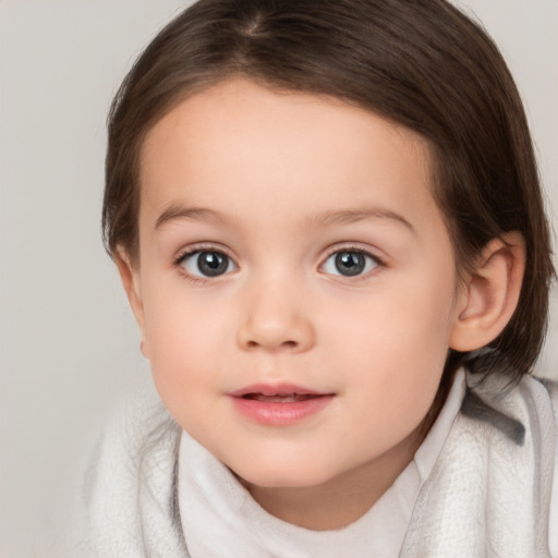 Joyful white child female with medium  brown hair and brown eyes