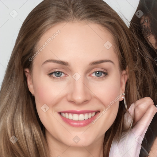 Joyful white young-adult female with long  brown hair and grey eyes