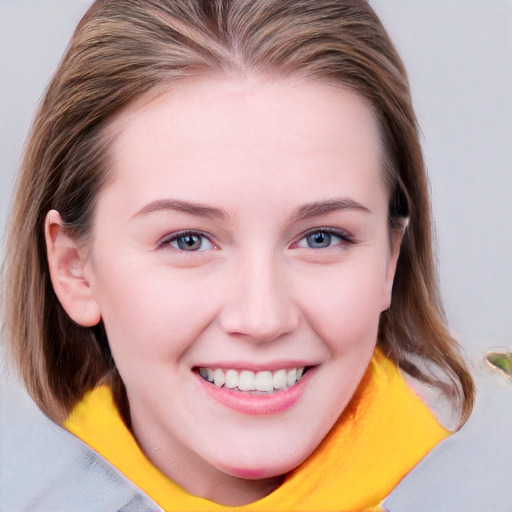 Joyful white young-adult female with medium  brown hair and blue eyes