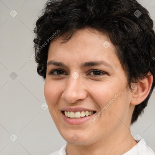 Joyful white young-adult female with short  brown hair and brown eyes