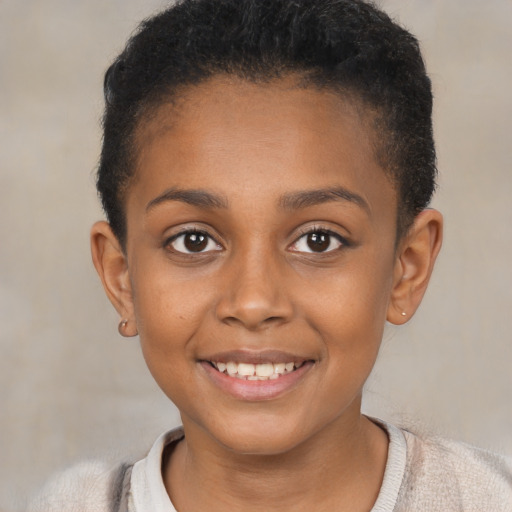 Joyful black child female with short  brown hair and brown eyes